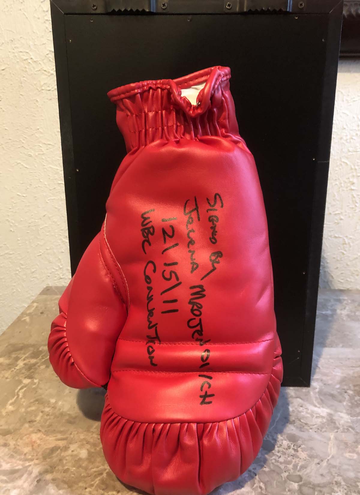 One (1) Autographed Glove - Jelena Mrdjenovich - signed on December 15, 2011